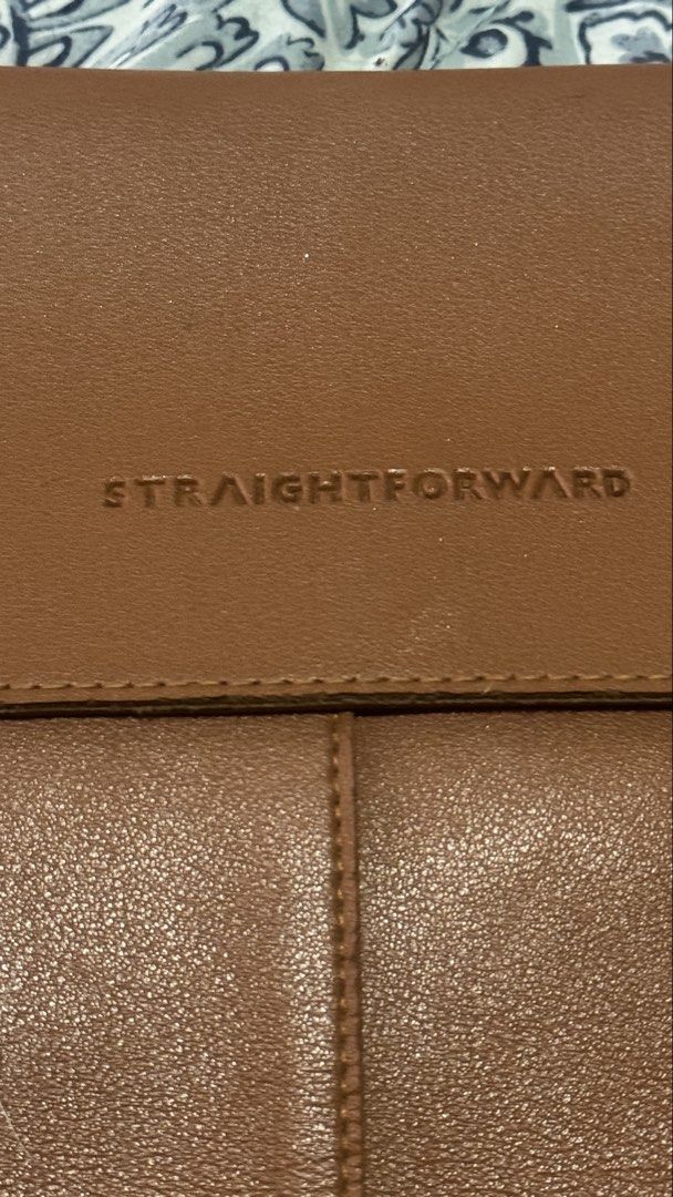 STRAIGHTFORWARD Brown Leather Laptop Sleeve Pouch (Category: Laptop Bags & Sleeves) located in Taguig. Submitted by flostrong (Listing ID 1457441916, Image 3). Description: - Genuine brown faux leather laptop sleeve from Straightforward - Magnetic snap closure for secure fastening - Fits laptops up to 13 inches - Slim and minimalist design - Provides excellent protection for your device on the go - Simple and highly functional RFS: not in use.