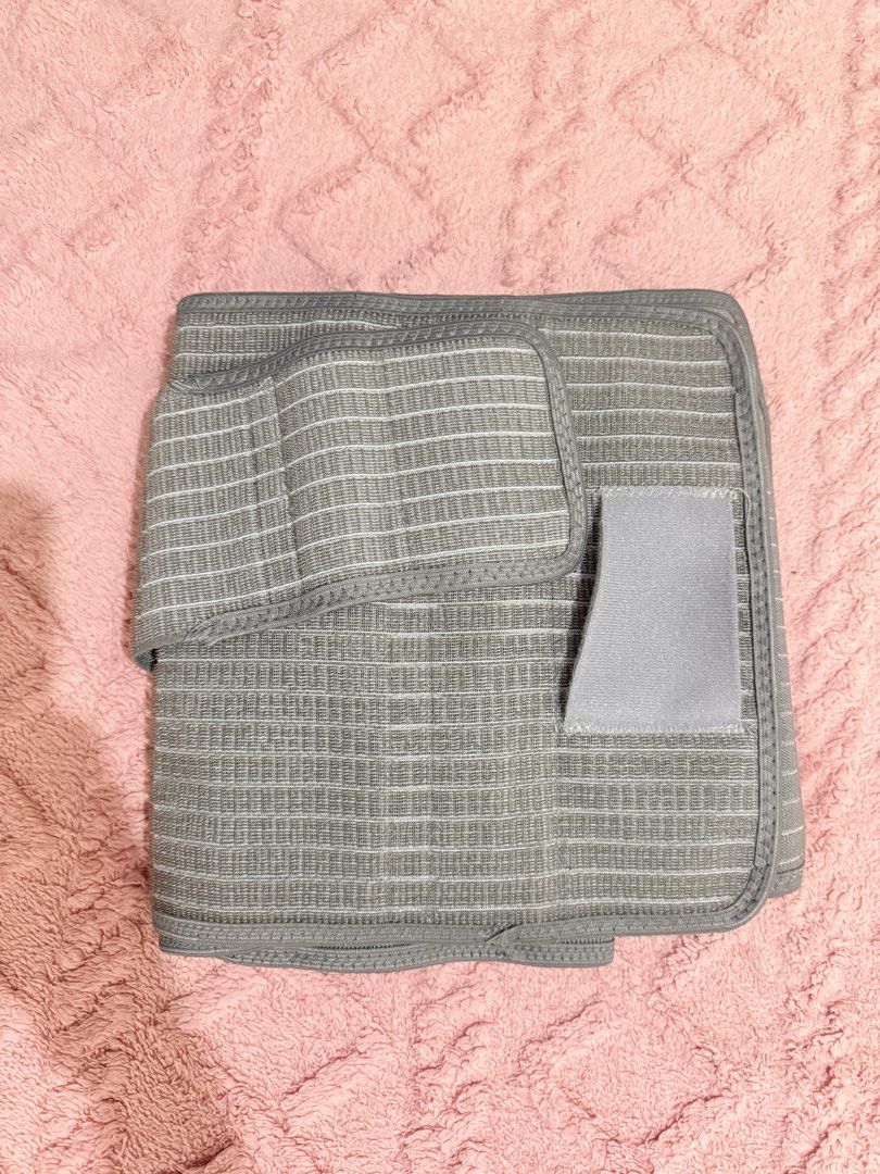 Sunveno Abdominal Binder Postpartum Belly Band (Category: Maternity Care) located in Makati City. Submitted by akimoie (Listing ID 1457336295, Image 1). Description: - Grey elastic abdominal binder - Features subtle white pinstripes - Stretchy and supportive material - Adjustable velcro closure for a custom fit - Perfect for postpartum recovery - Provides general abdominal support - Easy to wear discreetly under clothing.