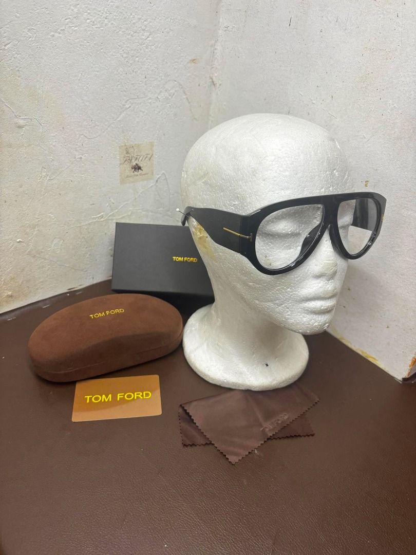 Tom Ford Pilot Frame Eyewear | Black Acetate with Case & Box (Category: Vision Care) located in Bacoor. Submitted by fafofa (Listing ID 1457497120, Image 3). Description: om Ford pilot-frame eyewear in bold black acetate, featuring the signature gold-tone metal T-logo at the temple hinge. • Black acetate frame • Gold-tone T-logo detail • Includes original box and case • Classic pilot-frame design for pre-order 3 to 7 days ETA.