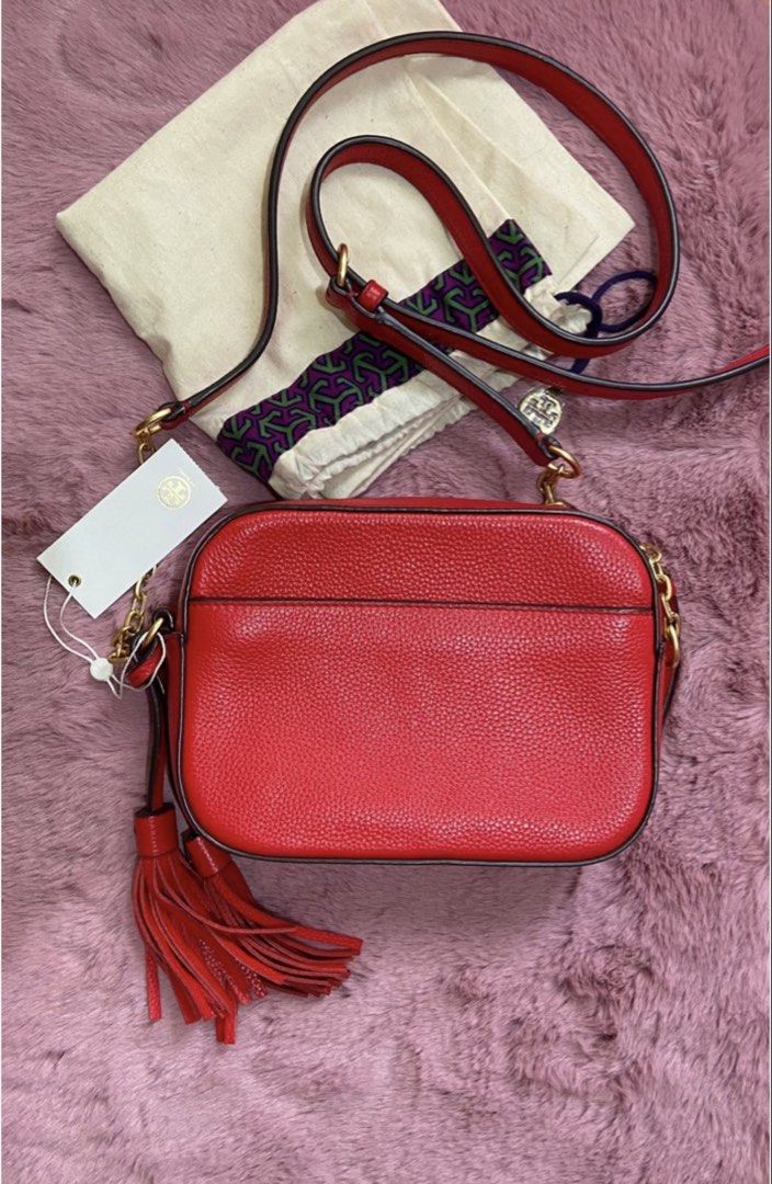 Tory Burch (Category: Luxury Bags & Wallets) located in Batangas. Submitted by aprileen (Listing ID 1457396033, Image 2). Description: Preloved Tory burch used few times 💯 Authentic - Genuine red leather crossbody bag - Elegant gold chain strap - Stylish side tassel details - Comes with original dust bag and tag - Versatile for everyday wear or evening outings - Spacious interior for all your essentials.
