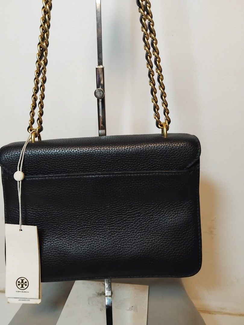 Tory Burch Kira Chevron Small Black Leather Shoulder Bag (Category: Luxury Bags & Wallets) located in Manila. Submitted by rosselegance (Listing ID 1457415607, Image 2). Description: - Authentic Tory Burch black leather bag - Elegant gold chain strap - Versatile: wear as a shoulder bag or crossbody - Spacious interior with multiple compartments and a zip pocket - Comes with original tag - Ideal for both everyday use and nights out.