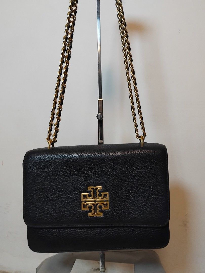 Tory Burch Kira Chevron Small Black Leather Shoulder Bag (Category: Luxury Bags & Wallets) located in Manila. Submitted by rosselegance (Listing ID 1457415607, Image 1). Description: - Authentic Tory Burch black leather bag - Elegant gold chain strap - Versatile: wear as a shoulder bag or crossbody - Spacious interior with multiple compartments and a zip pocket - Comes with original tag - Ideal for both everyday use and nights out.