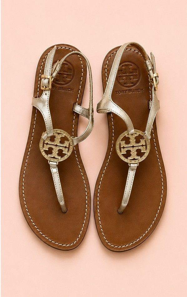 Tory Burch Miller Sandals Metallic Gold (Category: Flats & Sandals) located in Dasmarinas. Submitted by pitato.corner_2621 (Listing ID 1457421919, Image 1). Description: - Classic Tory Burch Miller sandals - Metallic gold color - Genuine leather insole with signature Tory Burch logo - Adjustable ankle strap for a secure fit - Highly versatile, pairs well with any outfit - Ideal for summer wear.