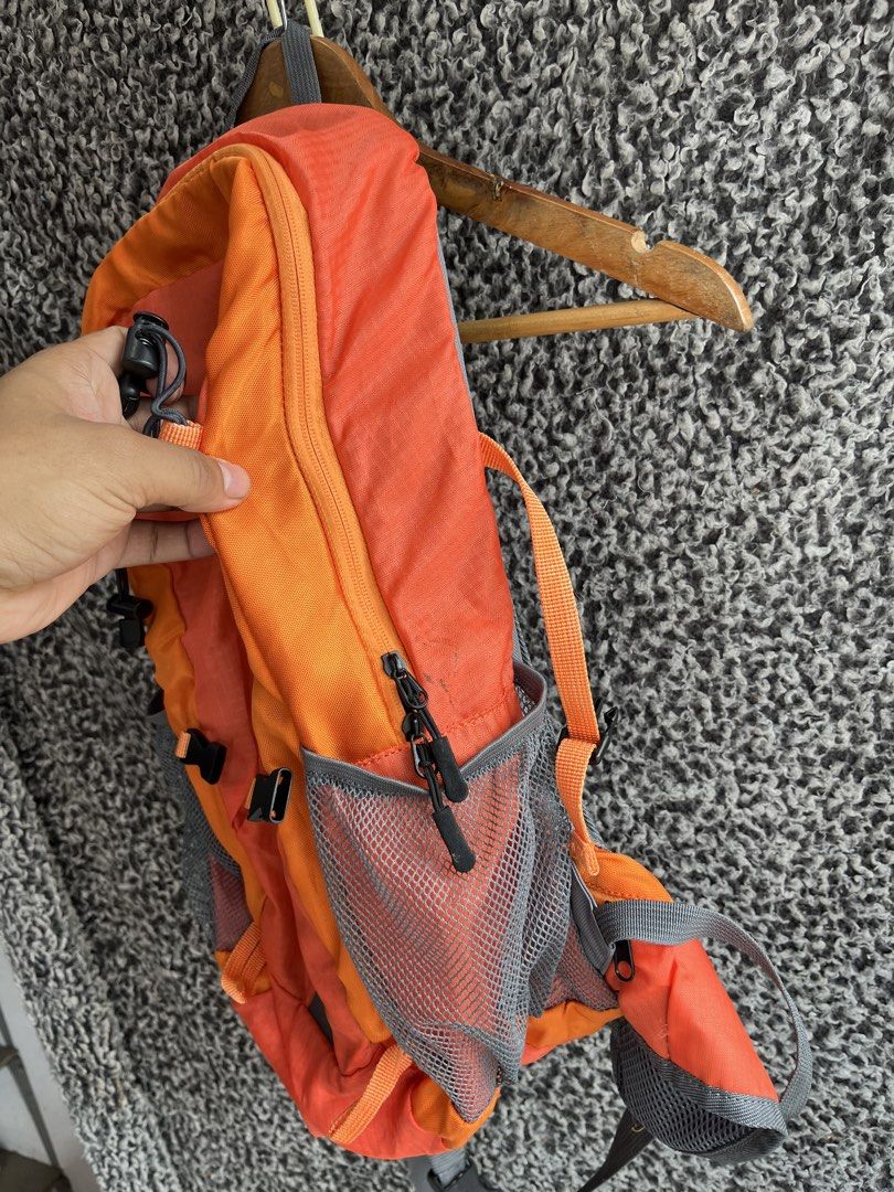 Treksta Leisure Time 28L Hiking Backpack. (Category: Backpacks) located in General Trias. Submitted by zrchustle.604 (Listing ID 1457413812, Image 2). Description: Treksta Leisure Time 28L Hiking Backpack. Key FeaturesBrand: Treksta (Leisure Time series) Capacity: 28 Liters Design: Vibrant orange and grey dual-tone styling with large diagonal "LEISURE TIME" text graphicsBuild: Includes mesh side pockets for water bottles, a bottom reflective acce
