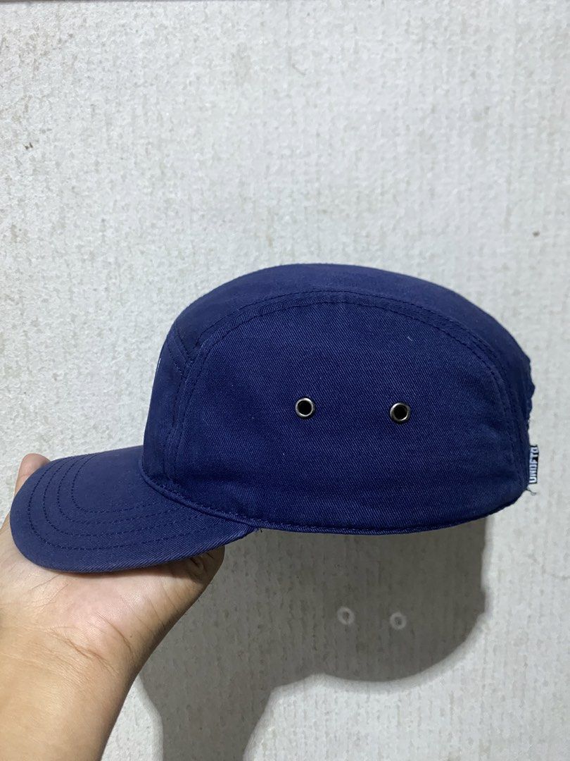 UNDFTD 5 Panel Cap Navy Blue (Category: Caps & Hats) located in Puerto Princesa. Submitted by earlpogitrhift (Listing ID 1457398209, Image 2). Description: - Navy blue UNDFTD 5-panel cap - Features 'UNDFTD P.E. 310' graphic on the front - Adjustable strap at the back for a customized fit - Green underbrim for added style - Made in China - Ideal for everyday wear.