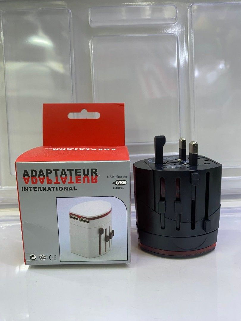 Universal Travel Adapter with USB Charger (Category: Chargers & Cables) located in Manila. Submitted by iliasjen3082126 (Listing ID 1457458075, Image 2). Description: - Universal travel adapter for international use - Features multiple plug types - Includes USB ports for charging devices - Compact and convenient for travel - Perfect for your trips abroad!.