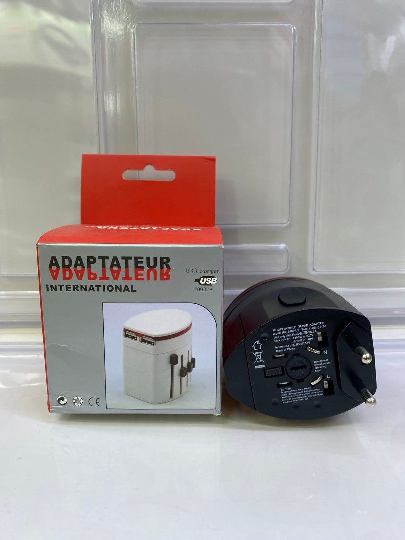 Universal Travel Adapter with USB Charger (Category: Chargers & Cables) located in Manila. Submitted by iliasjen3082126 (Listing ID 1457458075, Image 1). Description: - Universal travel adapter for international use - Features multiple plug types - Includes USB ports for charging devices - Compact and convenient for travel - Perfect for your trips abroad!.