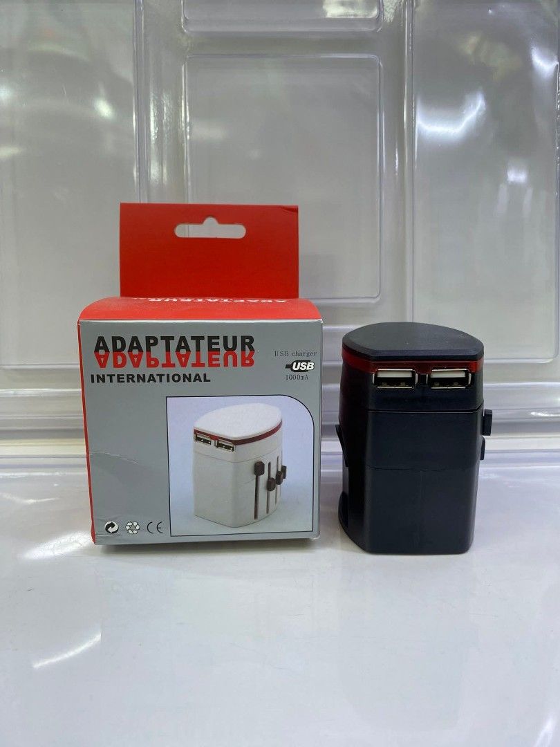 Universal Travel Adapter with USB Charger (Category: Chargers & Cables) located in Manila. Submitted by iliasjen3082126 (Listing ID 1457458075, Image 3). Description: - Universal travel adapter for international use - Features multiple plug types - Includes USB ports for charging devices - Compact and convenient for travel - Perfect for your trips abroad!.