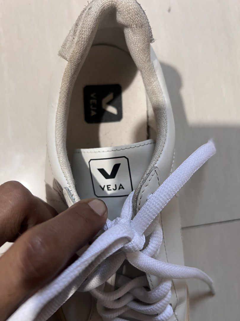 Veja White Leather Sneakers (Category: Sneakers) located in Zamboanga. Submitted by safe.haimer (Listing ID 1457447193, Image 3). Description: - Classic white Veja sneakers -38 - Genuine leather material - Signature V logo detail - Natural rubber soles - Minor signs of wear on heel tab and around the sole - Perfect for everyday wear - Laces included.