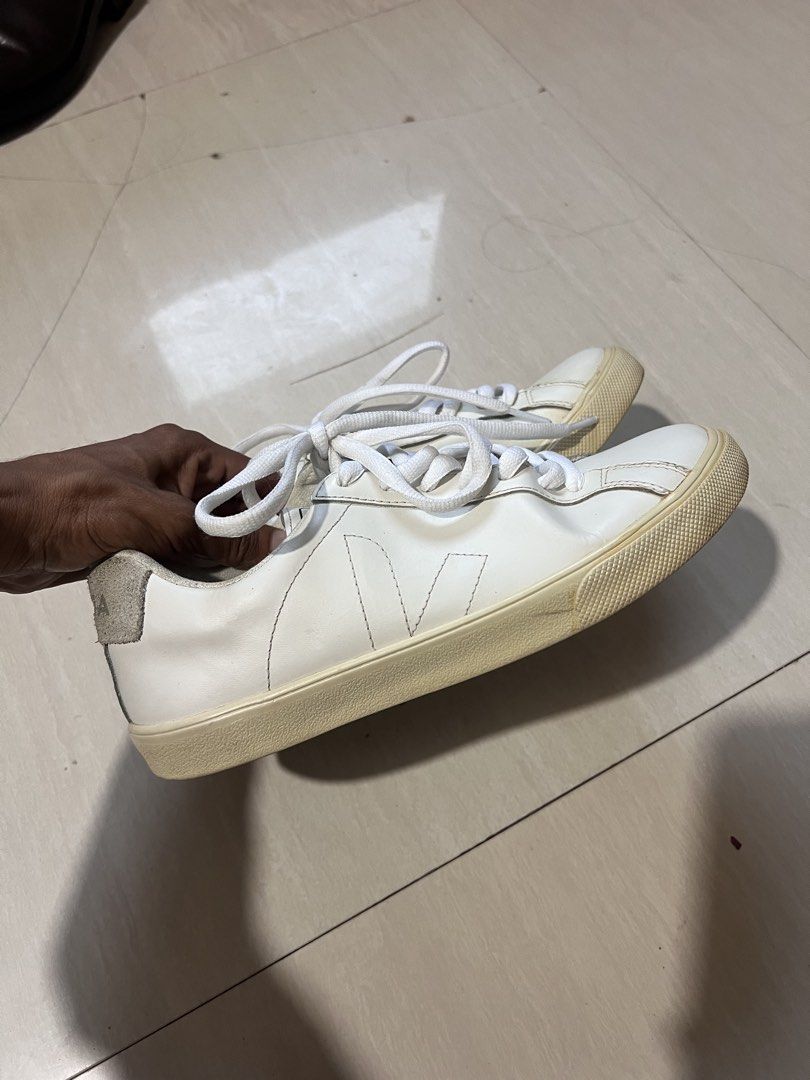 Veja White Leather Sneakers (Category: Sneakers) located in Zamboanga. Submitted by safe.haimer (Listing ID 1457447193, Image 2). Description: - Classic white Veja sneakers -38 - Genuine leather material - Signature V logo detail - Natural rubber soles - Minor signs of wear on heel tab and around the sole - Perfect for everyday wear - Laces included.