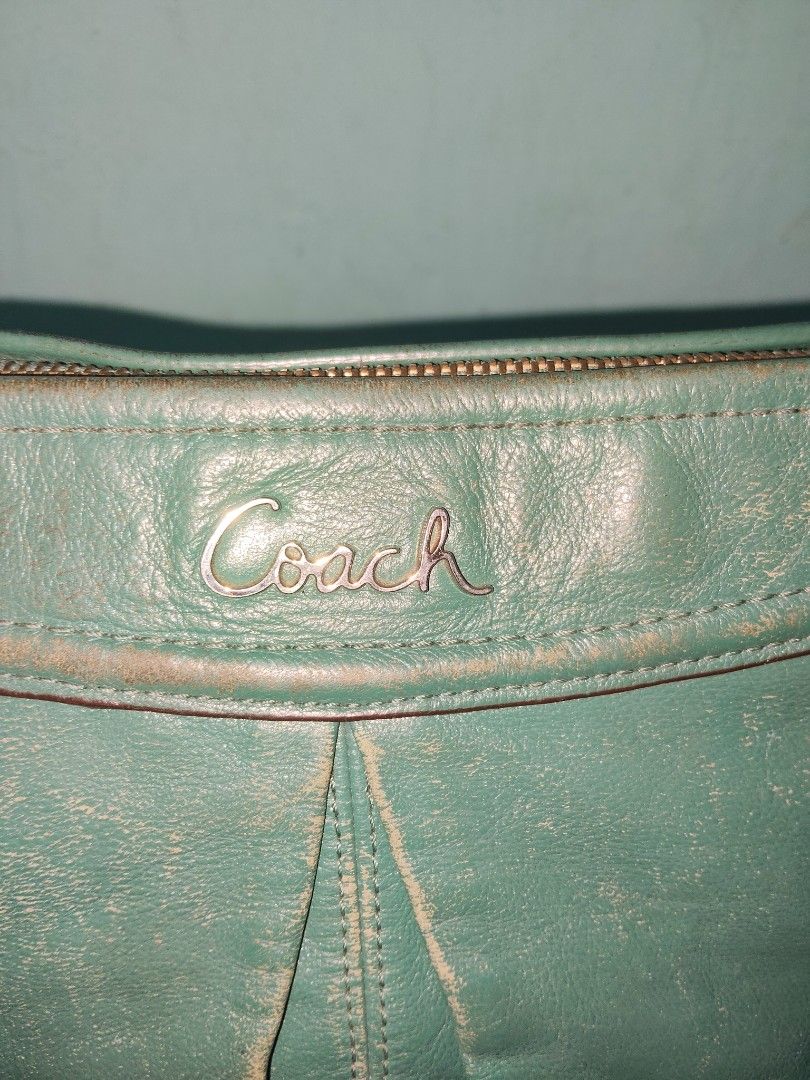 Vintage Coach Green Leather Shoulder Bag (Category: Luxury Bags & Wallets) located in City of Isabela. Submitted by jasheverything (Listing ID 1457500389, Image 2). Description: - Authentic Coach green leather shoulder bag - Secure zip closure - Convenient front zip pocket - Textured leather with a premium feel - Stylish silver hardware accents - Adjustable shoulder strap with chic chain details - Ideal for everyday wear Good Vintage Condition 20
