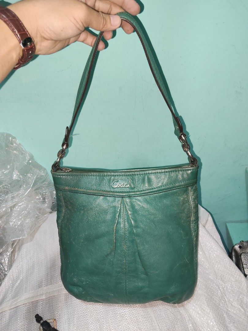 Vintage Coach Green Leather Shoulder Bag (Category: Luxury Bags & Wallets) located in City of Isabela. Submitted by jasheverything (Listing ID 1457500389, Image 1). Description: - Authentic Coach green leather shoulder bag - Secure zip closure - Convenient front zip pocket - Textured leather with a premium feel - Stylish silver hardware accents - Adjustable shoulder strap with chic chain details - Ideal for everyday wear Good Vintage Condition 20