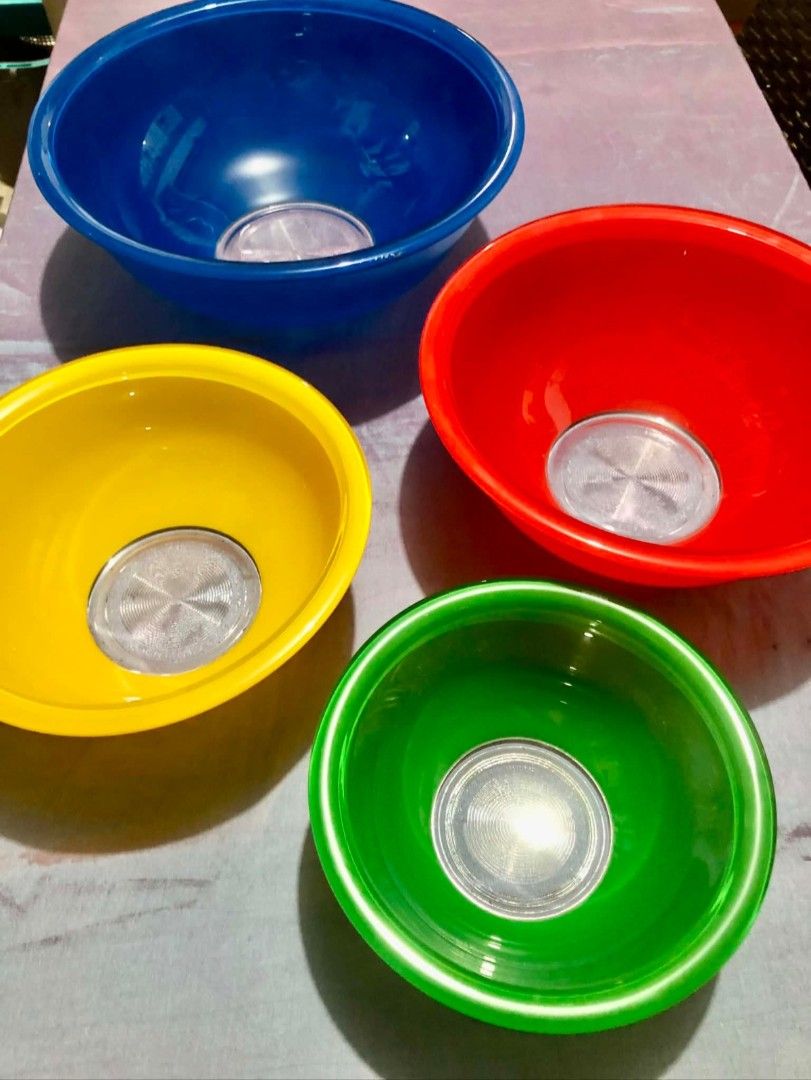 Vintage Pyrex Rainbow Nesting Mixing Bowl Set (Category: Other Kitchenware & Tableware) located in Quezon City. Submitted by goodbuyguy (Listing ID 1457348365, Image 1). Description: P3500 - 4 Piece Set Reduced to 2,800 Vintage Pyrex Rainbow nesting mixing bowls with clear glass bottoms, featuring 4 colorful bowls in blue, red, yellow, and green. Condition: Pre-owned vintage condition with normal sign of age and use. Please review all photos clos
