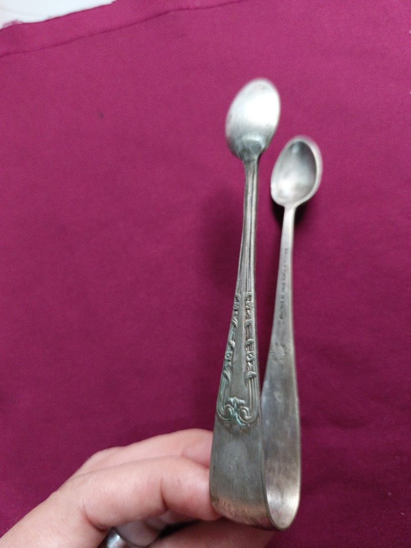 Vintage Silver Sugar Tongs with Spoon Ends (Category: Dinnerware & Cutlery) located in Batangas. Submitted by lavu4555 (Listing ID 1457373593, Image 1). Description: - Antique silver color sugar tongs - Features two small spoon ends for serving - Ornate detailing on the handles - Ideal for sugar cubes or small appetizers - Adds vintage charm to kitchen or tea set.