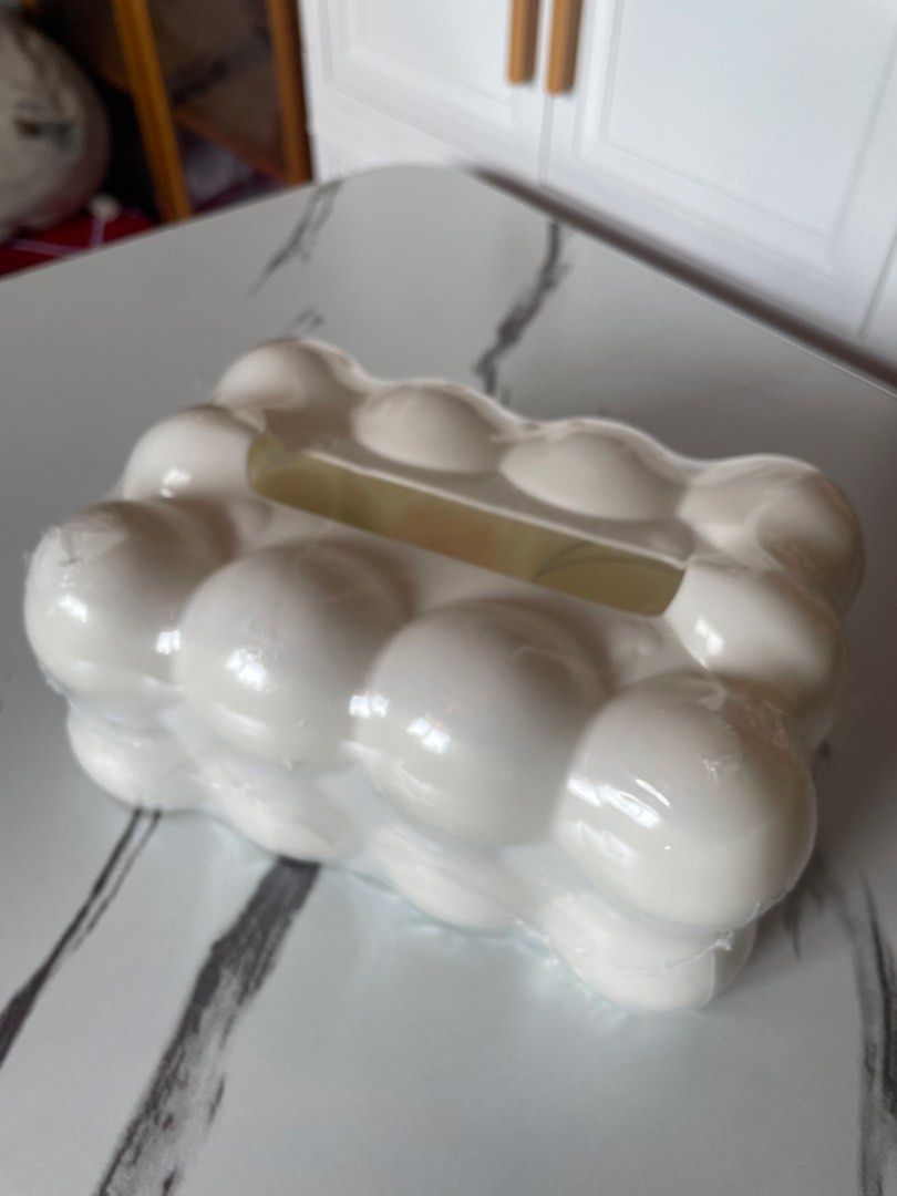 White Bubble Design Tissue Box Dispenser (Category: Storage Boxes & Baskets) located in Binangonan. Submitted by shianloves33961 (Listing ID 1457489863, Image 1). Description: - Adorable white tissue box cover - Features a unique bubble design - Fits standard tissue box sizes - Adds a fun and playful touch to your decor - Ideal for living rooms, bedrooms, and offices - Simple and easy to use.