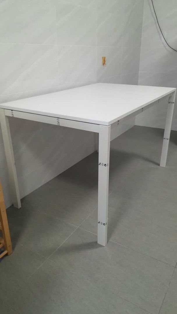White Rectangular Dining Table (Category: Tables & Sets) located in Singapore. Submitted by cathuskzie (Listing ID 1457354954, Image 2). Description: L125cm x W75cm x H74cm - Simple white rectangular table - Sturdy metal legs - Perfect for dining or as a work desk - Easy to assemble - Fits well in most spaces - Clean and modern design - Ready for a new home *Price negotiable.