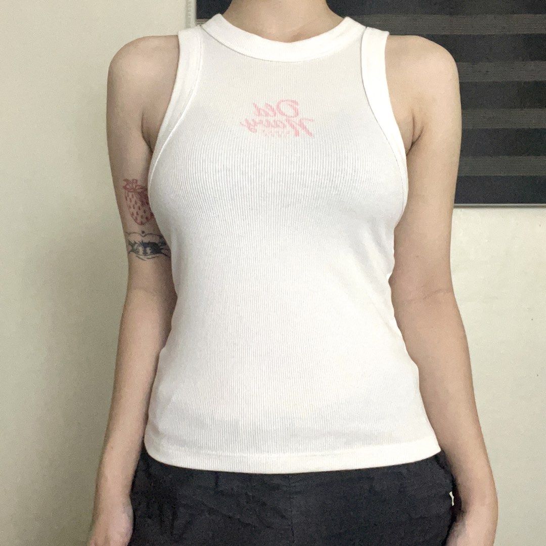 White Tank Top (Category: Sleeveless) located in Balanga. Submitted by eijispace (Listing ID 1457458793, Image 1). Description: - White ribbed tank top - Sleeveless design with a high neckline - Stretchy material - XS-S.
