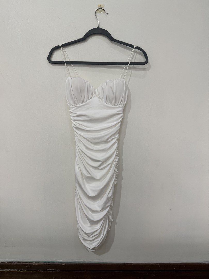 White Ruched Bodycon Mini Dress Spaghetti Straps (Category: Dresses) located in Muntinlupa City. Submitted by jtarchive (Listing ID 1457443562, Image 2). Description: - White ruched mini dress Only worn once for Halloween party - Sweetheart neckline - Bodycon fit - Ideal for parties or nights out - Back zipper closure - Fabric with a slight sheen.