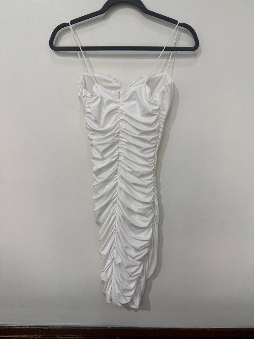 White Ruched Bodycon Mini Dress Spaghetti Straps (Category: Dresses) located in Muntinlupa City. Submitted by jtarchive (Listing ID 1457443562, Image 3). Description: - White ruched mini dress Only worn once for Halloween party - Sweetheart neckline - Bodycon fit - Ideal for parties or nights out - Back zipper closure - Fabric with a slight sheen.