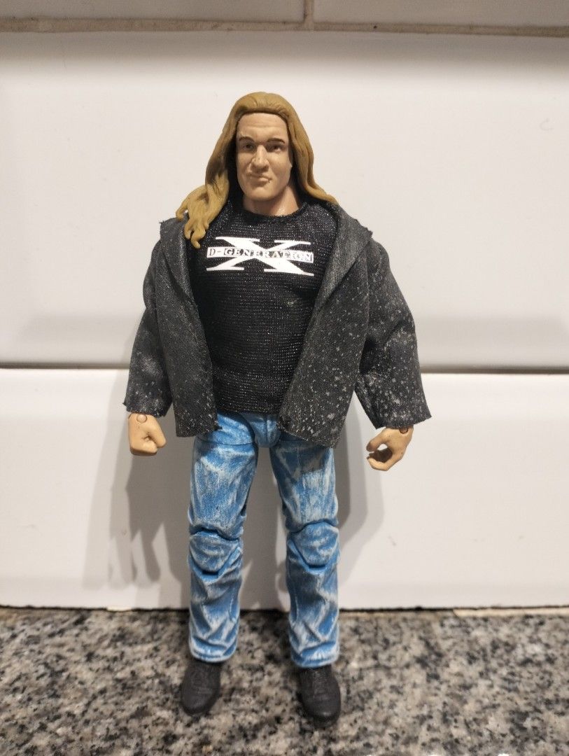 WWE D-Generation X "Triple H" Action Figure (Category: Action & Battle Toys) located in Cabuyao City. Submitted by boozerboy21 (Listing ID 1457472239, Image 1). Description: - D-Generation X action figure - Resembles Triple H - D-X shirt, blue jeans, and grey jacket included - Good articulation for posing - Must-have for wrestling collectors.