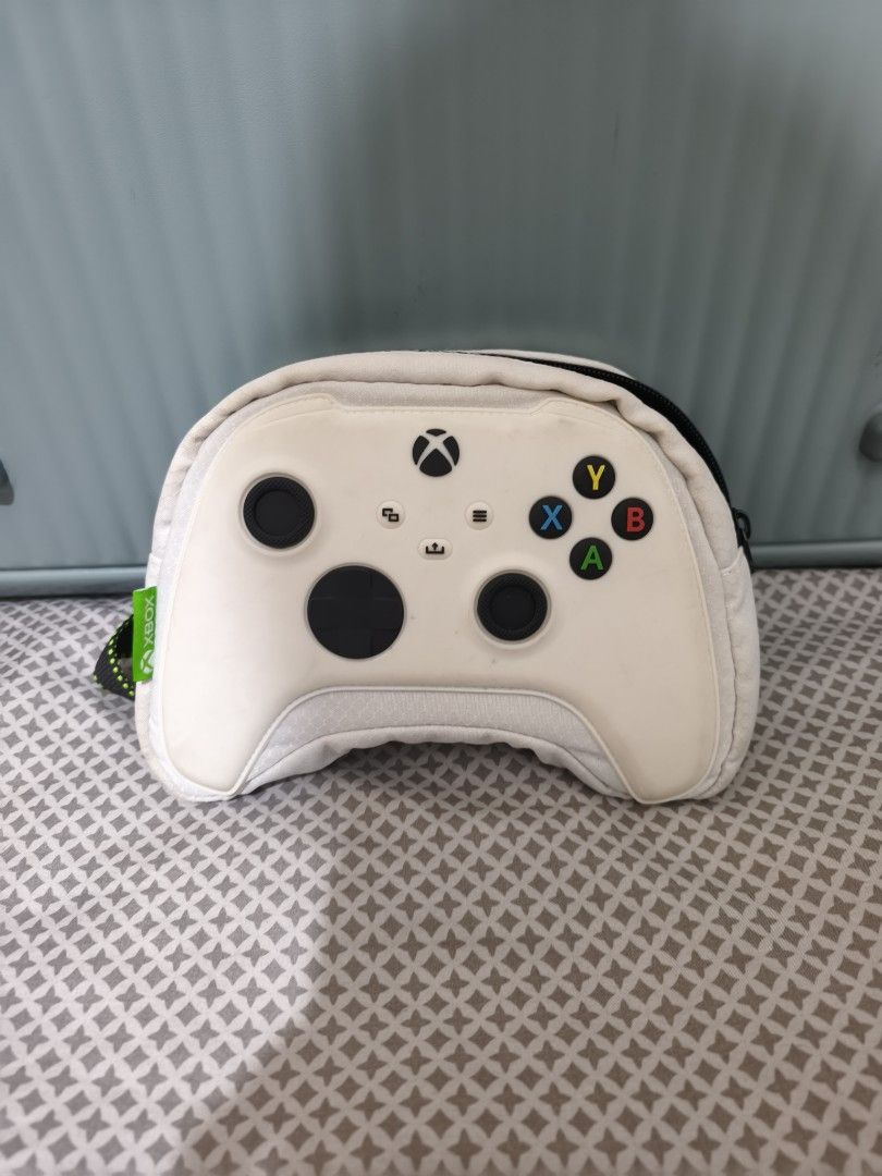 Xbox Controller Pouch Bag with Strap (Category: Controllers) located in Quezon City. Submitted by tajima (Listing ID 1457361273, Image 3). Description: - Zara Unique Xbox controller design - Durable pouch for controllers and accessories - Black and green strap for easy carrying - Secure zipper closure - Protect your gear on the go.