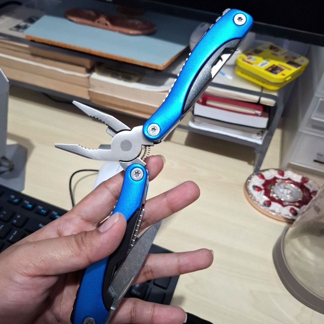14functions Multi-tool Plier foldable (Category: Home Improvement Tools & Accessories) located in Quezon City. Submitted by an.marie (Listing ID 1457576927, Image 2). Description: multi-tool with pliers, knife, and other folding tools. Includes a black fabric pouch. Compact and portable for everyday use. Perfect for quick fixes..