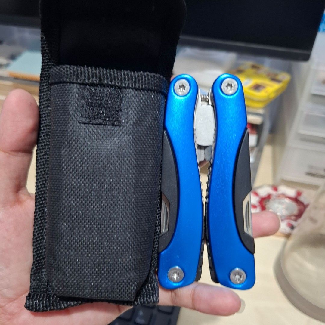14functions Multi-tool Plier foldable (Category: Home Improvement Tools & Accessories) located in Quezon City. Submitted by an.marie (Listing ID 1457576927, Image 1). Description: multi-tool with pliers, knife, and other folding tools. Includes a black fabric pouch. Compact and portable for everyday use. Perfect for quick fixes..