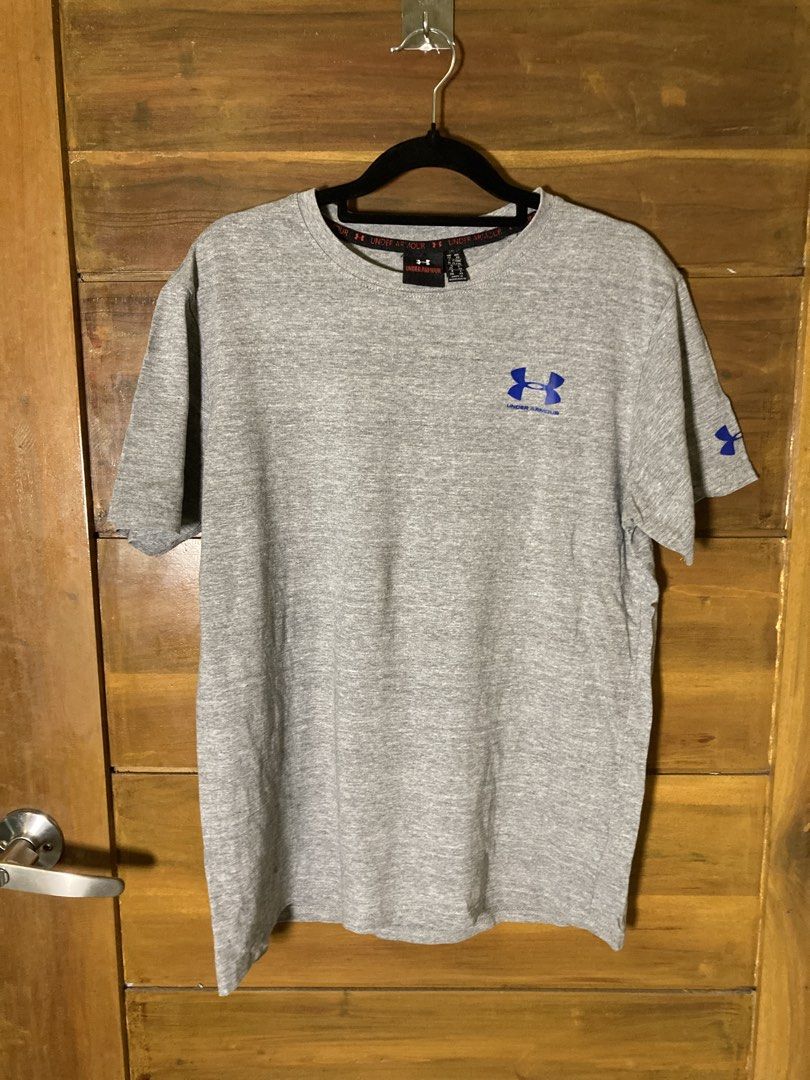 ₱10 + Shipping Fee. (Category: Tshirts & Polo Shirts ) located in Batangas. Submitted by declutteringvon (Listing ID 1457664283, Image 1). Description: - Grey Under Armour T-shirt - Features classic blue Under Armour logo on chest and sleeve - Comfortable and casual design - Ideal for workouts or everyday wear - Made in Bangladesh.