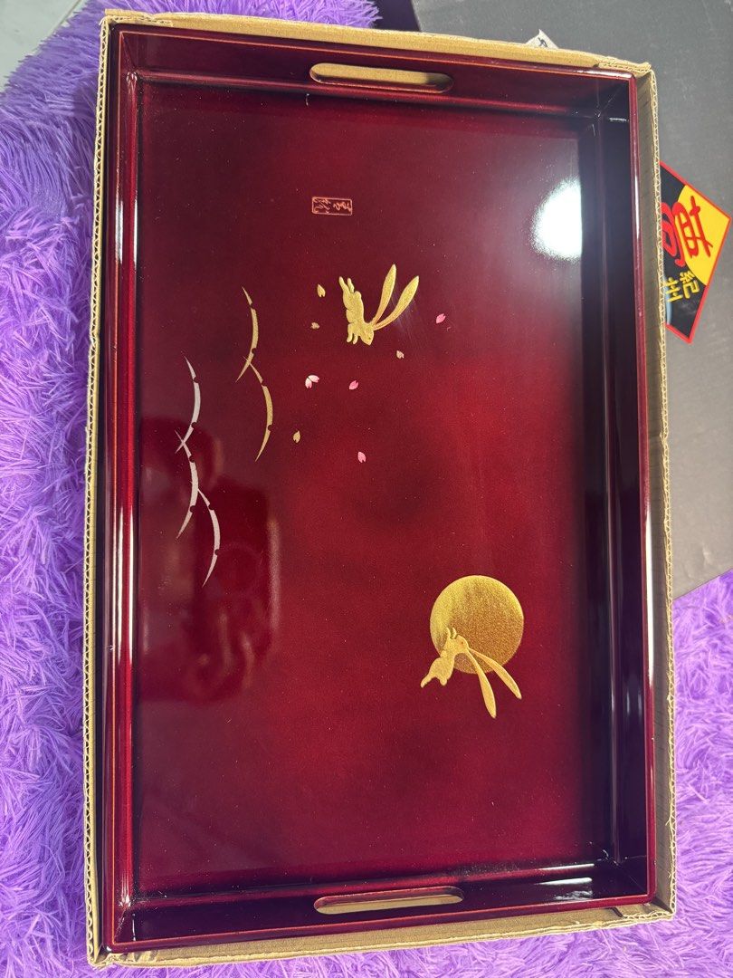 ✨ Elegant Vintage Japanese Lacquer Serving/Display Tray ✨ (Category: Other Kitchenware & Tableware) located in Pasig City. Submitted by msjazzylad (Listing ID 1457616664, Image 1). Description: Beautiful deep burgundy/red lacquer tray featuring a delicate gold rabbit & moon design, with traditional Japanese-inspired artwork and built-in handles. Size: 26.4x42.5 cm Perfect for: 🍵 Tea/coffee serving 🍶 Japanese-themed dining 🏮 Home décor & displa