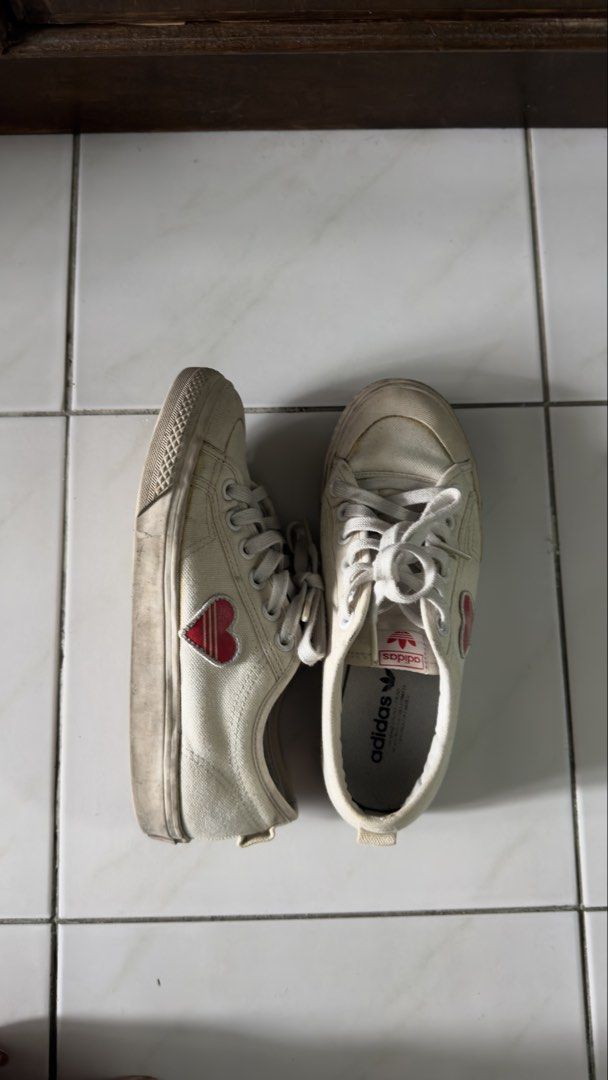 Adidas Nizza Heart Sneakers White (Category: Sneakers) located in Pasay City. Submitted by lainedeclutters (Listing ID 1457568677, Image 2). Description: - White Adidas Nizza sneakers - Size: 38 EU - Cute red heart detail on the side - Lace-up closure - Plenty of life left for casual wear Needs cleaning but overall ok pa..