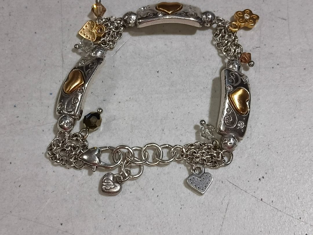 Authentic Brighton "Remember Your Heart" Two-Tone Charm Bracelet (Category: Bracelets) located in Marikina City. Submitted by my-an (Listing ID 1457655222, Image 3). Description: Authentic Brighton "Remember Your Heart" charm bracelet in pristine, like-new condition. Features heavy silver-plated link chains accented with brushed gold-toned heart tiles and dangling crystal charms. The reverse sides of the silver tiles are beautifully engraved with