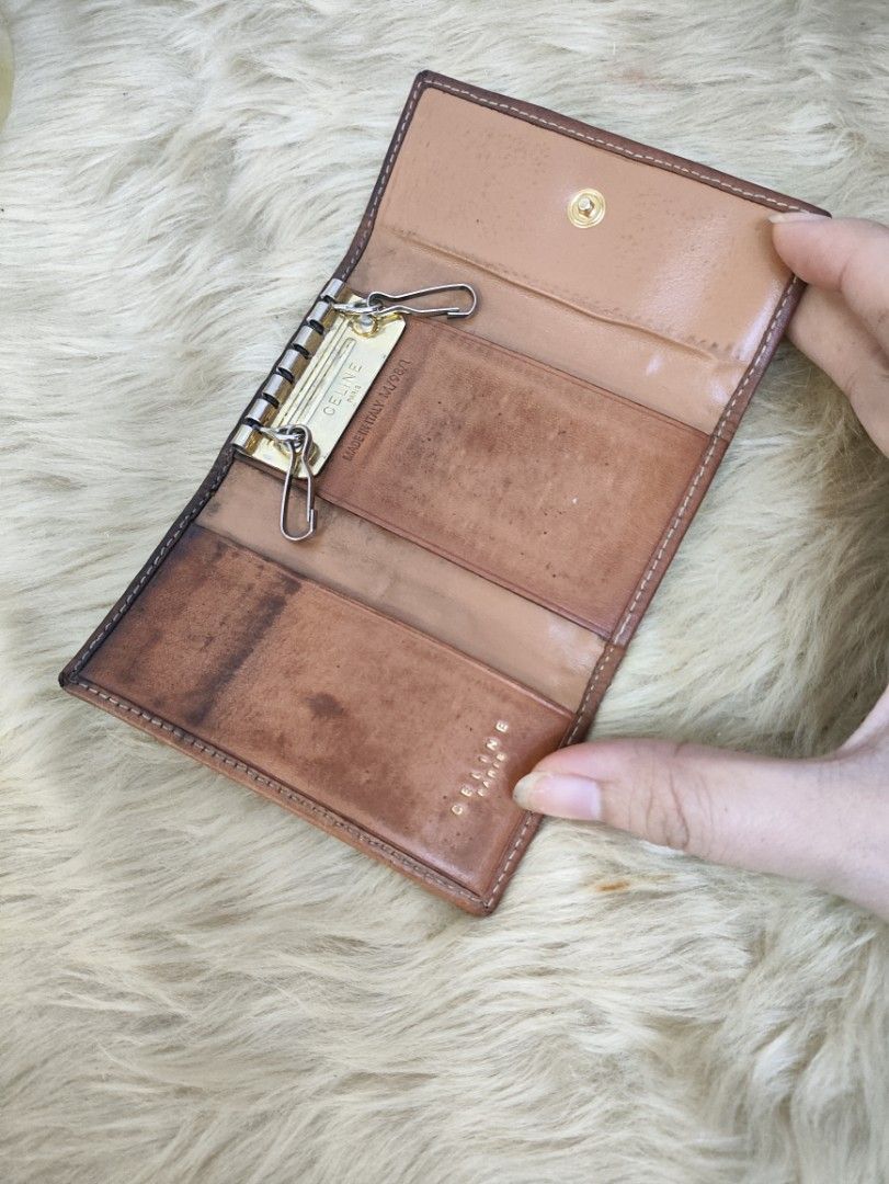 Authentic CELINE Macadam PVC Leather key case (Category: Luxury Bags & Wallets) located in Rizal. Submitted by hsiri1128 (Listing ID 1457552748, Image 2). Description: 💯✔️Legit 📌From Japan Box ISSUE : Need lagyan ng mga hooks inside. no cracks on leather. hardwares still gold ✨Fiocchi italy snap button.