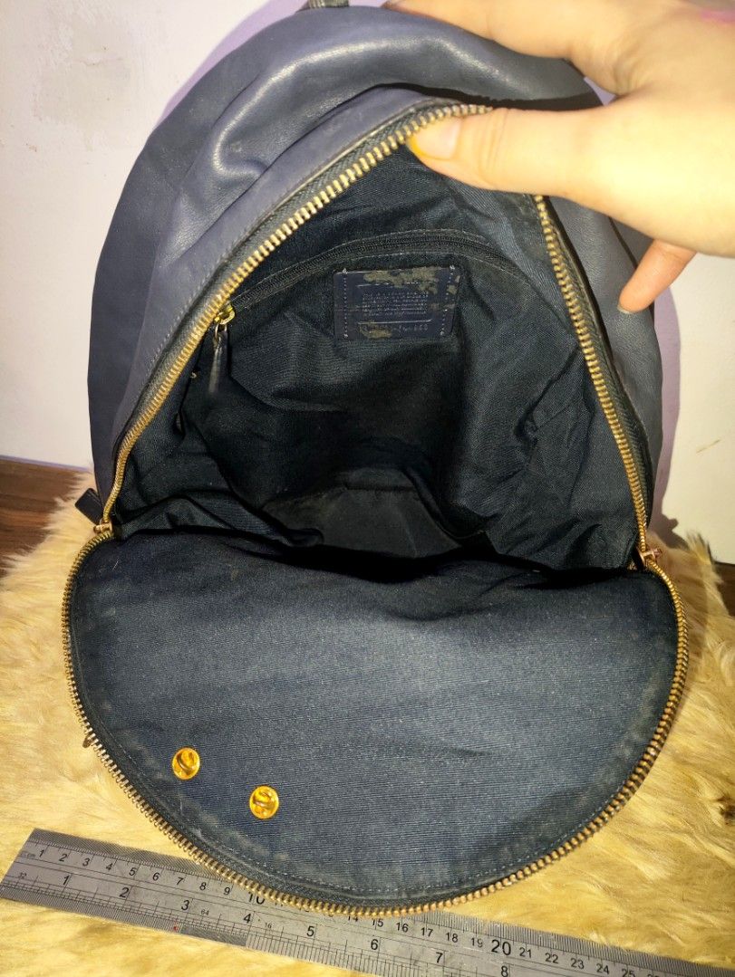 Authentic Coach charlie buffalo plaid PVC leather Back Pack (Category: Backpacks) located in Rizal. Submitted by hsiri1128 (Listing ID 1457657925, Image 3). Description: 💯✔️Legit 📌From Japan Box CONDITION : 7.5/10 ISSUE / FLAWS : normal signs of wear. my color transfer sa front kya nilagay c woody. maganda pa in actual MATERIAL : PVC leather w/ light gold hardwares. nylon ung back part. DETAILS : water repellant, hindi xa mabigat. fit ipad and 