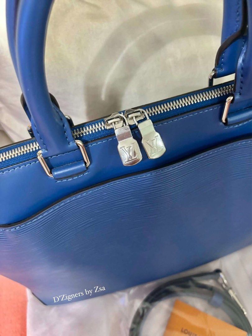 Authentic LV Blue Epi Briefcase (Category: Luxury Bags & Wallets) located in Quezon City. Submitted by DZignersbyZsa (Listing ID 1457606899, Image 2). Description: Authentic LV Briefcase in Blue epi leather Prestine condition With long strap, qr sticker and gift card .