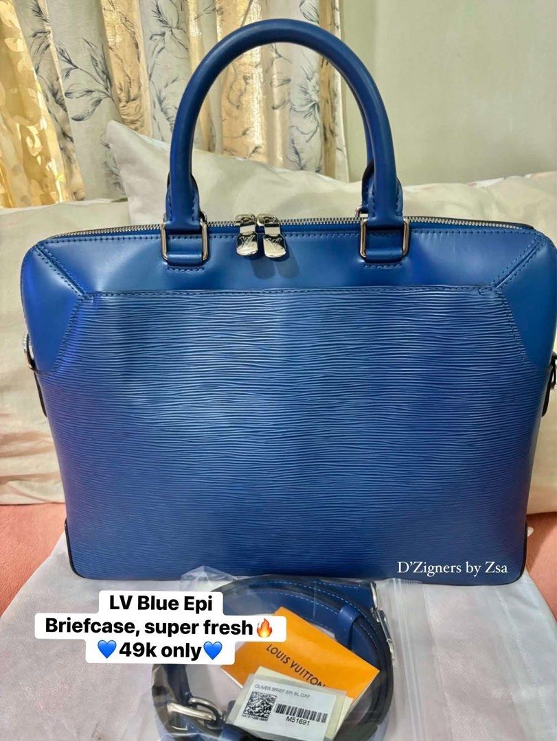 Authentic LV Blue Epi Briefcase (Category: Luxury Bags & Wallets) located in Quezon City. Submitted by DZignersbyZsa (Listing ID 1457606899, Image 1). Description: Authentic LV Briefcase in Blue epi leather Prestine condition With long strap, qr sticker and gift card .