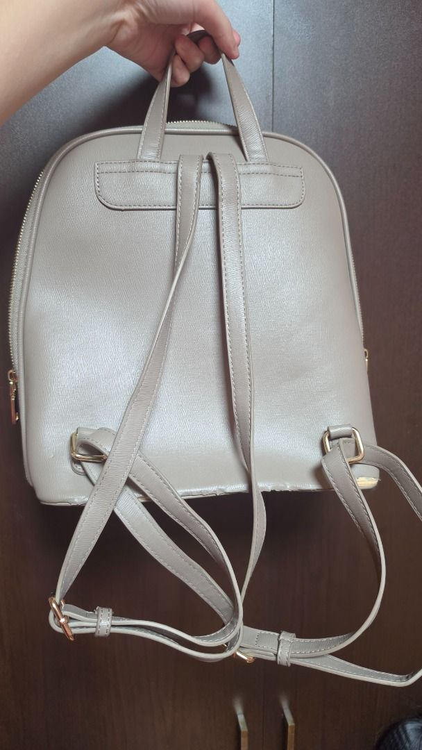 [AUTHENTIC] Miztique Grey Faux Leather Backpack (Category: Backpacks) located in Manila. Submitted by chisa05 (Listing ID 1457653917, Image 2). Description: Brand: Miztique Material: Faux Leather Features: Zipper enclosure, one three inner pockets, one outside pocket with magnetic enclosure Interior: Enough to fit a 11 inch IPad, good for school and office use NOTE: Second owner, bought from a friend, has signs of usage and peeling leather, swipe