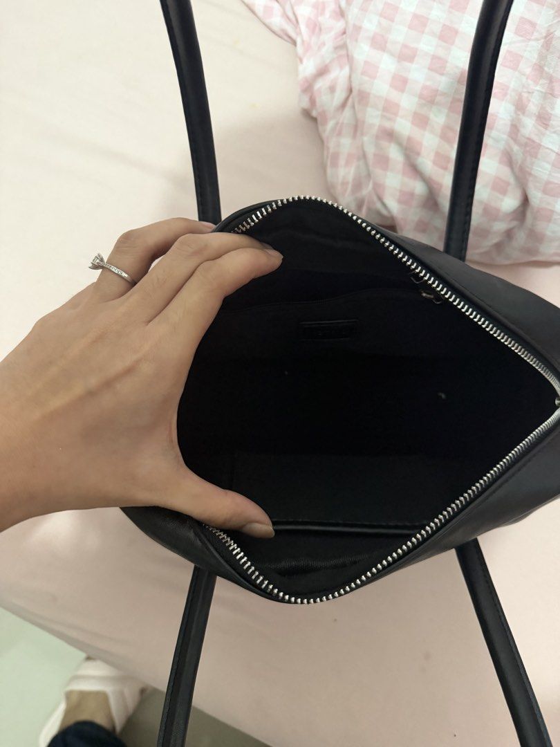 AZTRID Black Leather Handbag (Category: Shoulder Bags) located in Davao. Submitted by fabdeclutter (Listing ID 1457671844, Image 3). Description: - Brand: AZTRID - Material: Black Leather - Closure: Top Zip - Handles: Two rounded top handles - Hardware: Silver detail on the side - Style: Simple and classic - Ideal for: Everyday use.