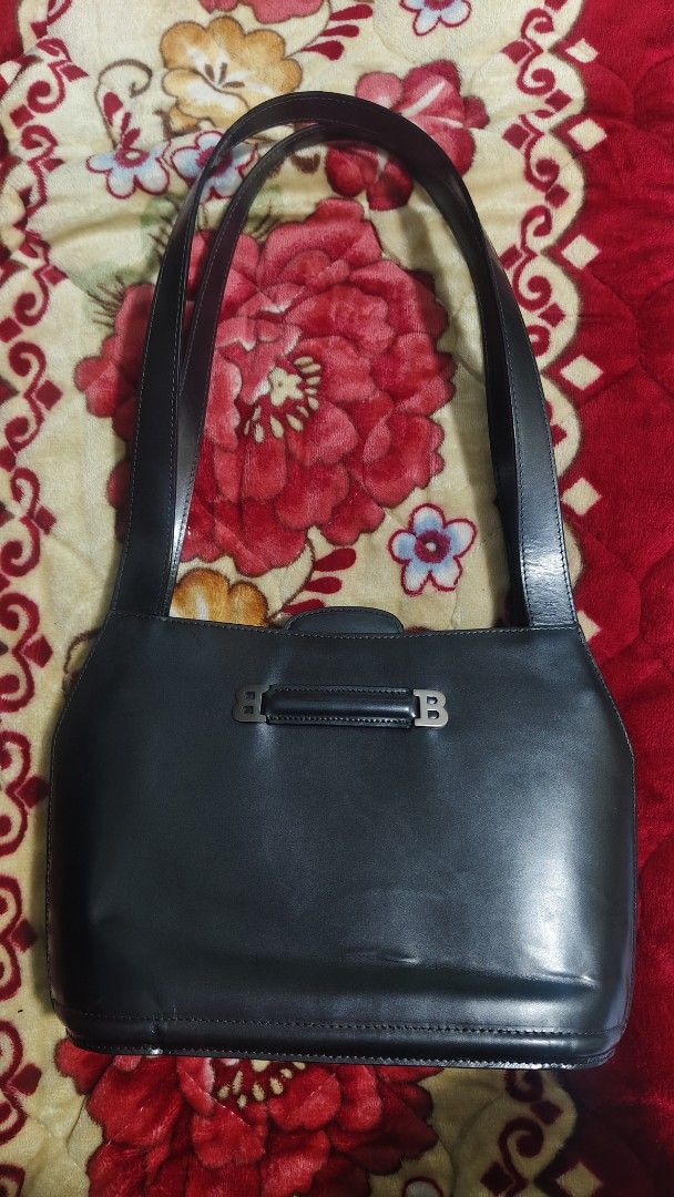 Bally Leather Shoulder Bag (Category: Luxury Bags & Wallets) located in Tambulig. Submitted by cmscloset_ph (Listing ID 1457558850, Image 2). Description: ORIG ✓ MONEY BACK! - Dark blue Bally shoulder bag - Smooth leather material - Iconic Bally 'B' logo hardware - Comfortable shoulder strap - Timeless and classic design - Suitable for daily use or special occasions.