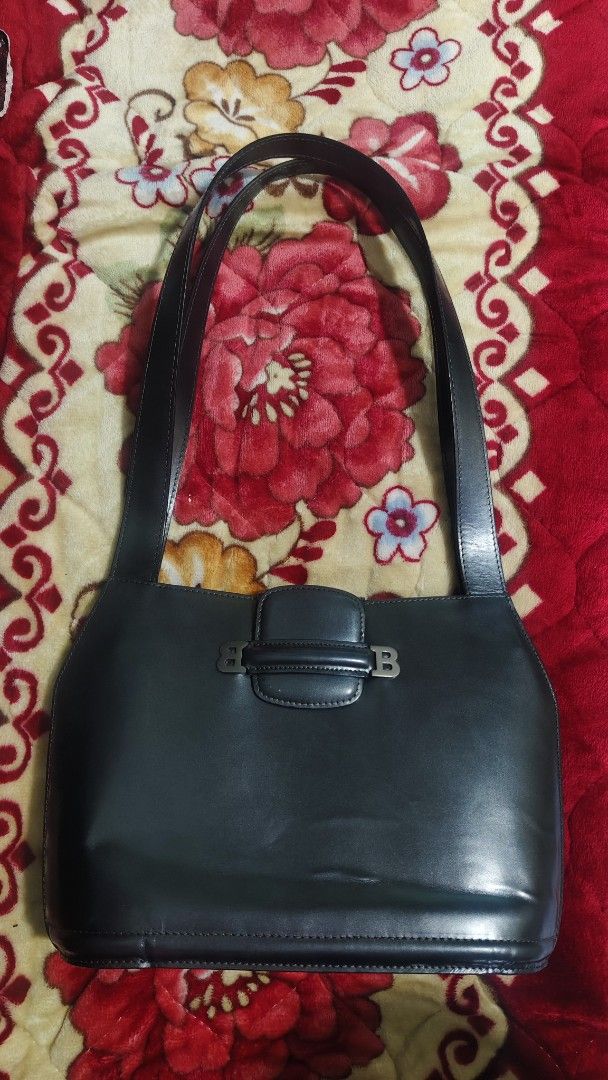 Bally Leather Shoulder Bag (Category: Luxury Bags & Wallets) located in Tambulig. Submitted by cmscloset_ph (Listing ID 1457558850, Image 3). Description: ORIG ✓ MONEY BACK! - Dark blue Bally shoulder bag - Smooth leather material - Iconic Bally 'B' logo hardware - Comfortable shoulder strap - Timeless and classic design - Suitable for daily use or special occasions.