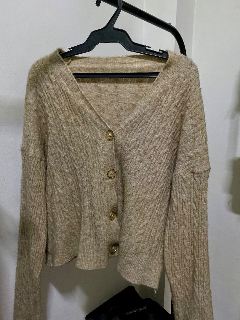 Brown Cable Knit Button Up Cardigan (Category: Coats, Jackets and Outerwear) located in Santa Rosa. Submitted by rockitlee (Listing ID 1457534771, Image 1). Description: - Cozy brown cardigan - Cable knit pattern - Gold button front closure - Long sleeves - Cropped length - Warm and comfortable for cooler weather - Ideal for layering over tops or dresses.