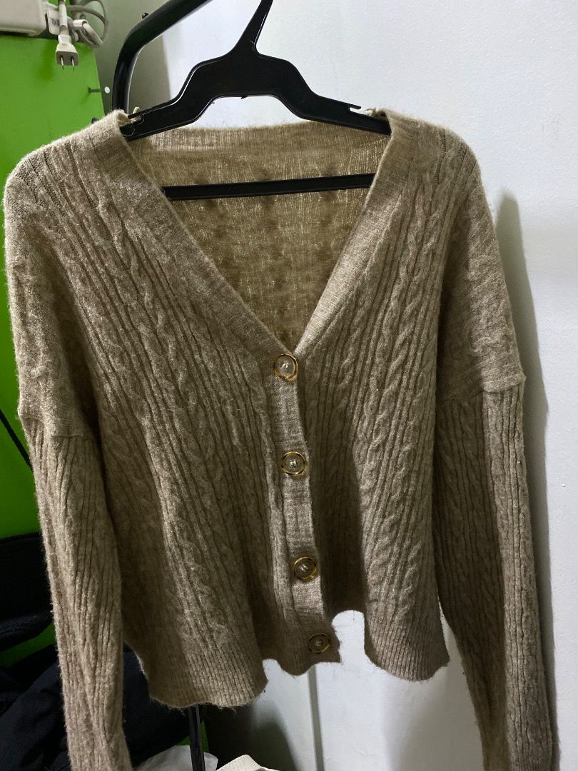 Brown Cable Knit Button Up Cardigan (Category: Coats, Jackets and Outerwear) located in Santa Rosa. Submitted by rockitlee (Listing ID 1457534771, Image 2). Description: - Cozy brown cardigan - Cable knit pattern - Gold button front closure - Long sleeves - Cropped length - Warm and comfortable for cooler weather - Ideal for layering over tops or dresses.