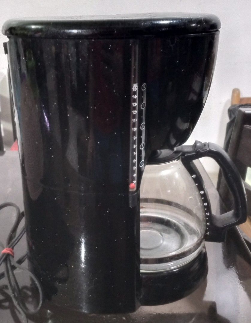 Black Drip Coffee Maker with Glass Carafe (Category: Coffee Machines & Makers) located in Bulacan. Submitted by samaelgoody (Listing ID 1457654515, Image 1). Description: - Basic black drip coffee maker - Includes a glass carafe - Water level markings on the side - Simple on/off switch - Fully functional, perfect for your morning coffee.