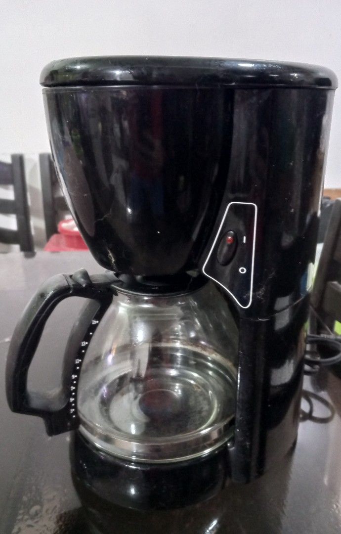 Black Drip Coffee Maker with Glass Carafe (Category: Coffee Machines & Makers) located in Bulacan. Submitted by samaelgoody (Listing ID 1457654515, Image 2). Description: - Basic black drip coffee maker - Includes a glass carafe - Water level markings on the side - Simple on/off switch - Fully functional, perfect for your morning coffee.