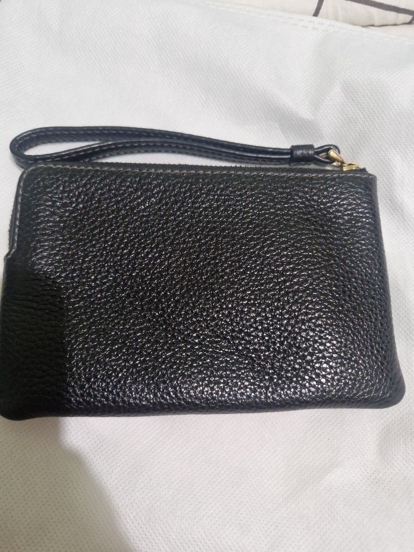Original Coach wristlet (Category: Clutches) located in Santa Rosa. Submitted by newmoon_44fcc8 (Listing ID 1457628701, Image 2). Description: - Black pebbled leather wristlet clutch -not detachable wristlet - Small embossed logo on the front - Secure zipper closure - Ideal for carrying your daily essentials.