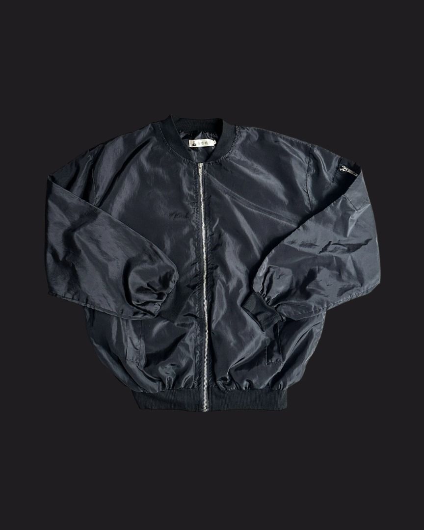 Black Nylon Bomber Jacket (Category: Coats, Jackets and Outerwear) located in Mandaluyong City. Submitted by shopsunnymoody (Listing ID 1457632830, Image 1). Description: Lightweight nylon black bomber jacket with zipped arm pocket and front pockets fits up to Large length: 65 cm width: 58 cm 9/10 quality: no issue 250 php + SF.