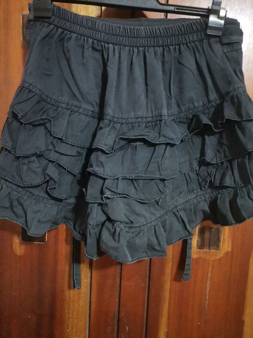 Black Ruffle Tiered Skort with Tie Waist (Category: Skirts) located in Makati City. Submitted by kookybearsstuff (Listing ID 1457641138, Image 2). Description: - Adorable black mini skort - Features multiple ruffles and tiers for a playful look - Adjustable tie waist detail - Estimated size: Small to Medium (please check measurements if available) - Perfect for casual outings or dressing up - Effortlessly pairs with various tops for different sty