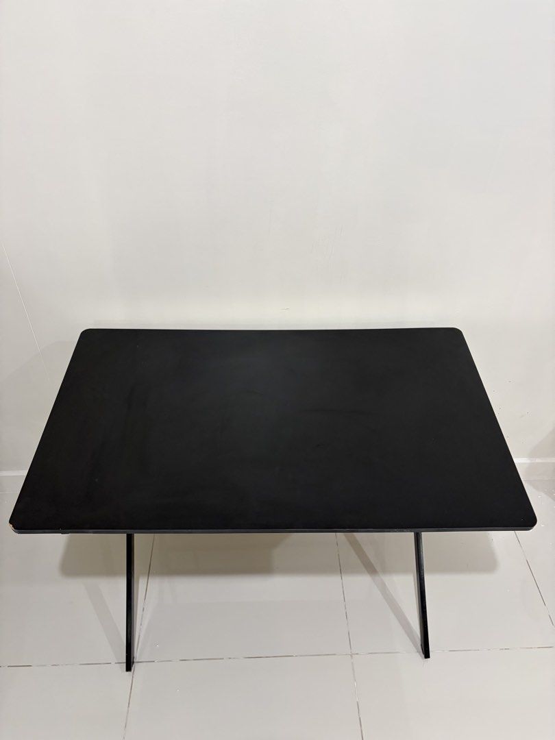 Black Study/Work Table (Category: Tables & Sets) located in Manila. Submitted by jesse.ko (Listing ID 1457591451, Image 3). Description: Black Study Table 100cm (width) x 60cm (length) x 75cm (height) Selling my black work table in good condition. Used for around 4 months only, then stored in the garage. Minor damage: chipping on one corner of the tabletop (see 5th photo) No major issues Originally bought for: ₱1,100 -PRICE NEGOTIABLE-.