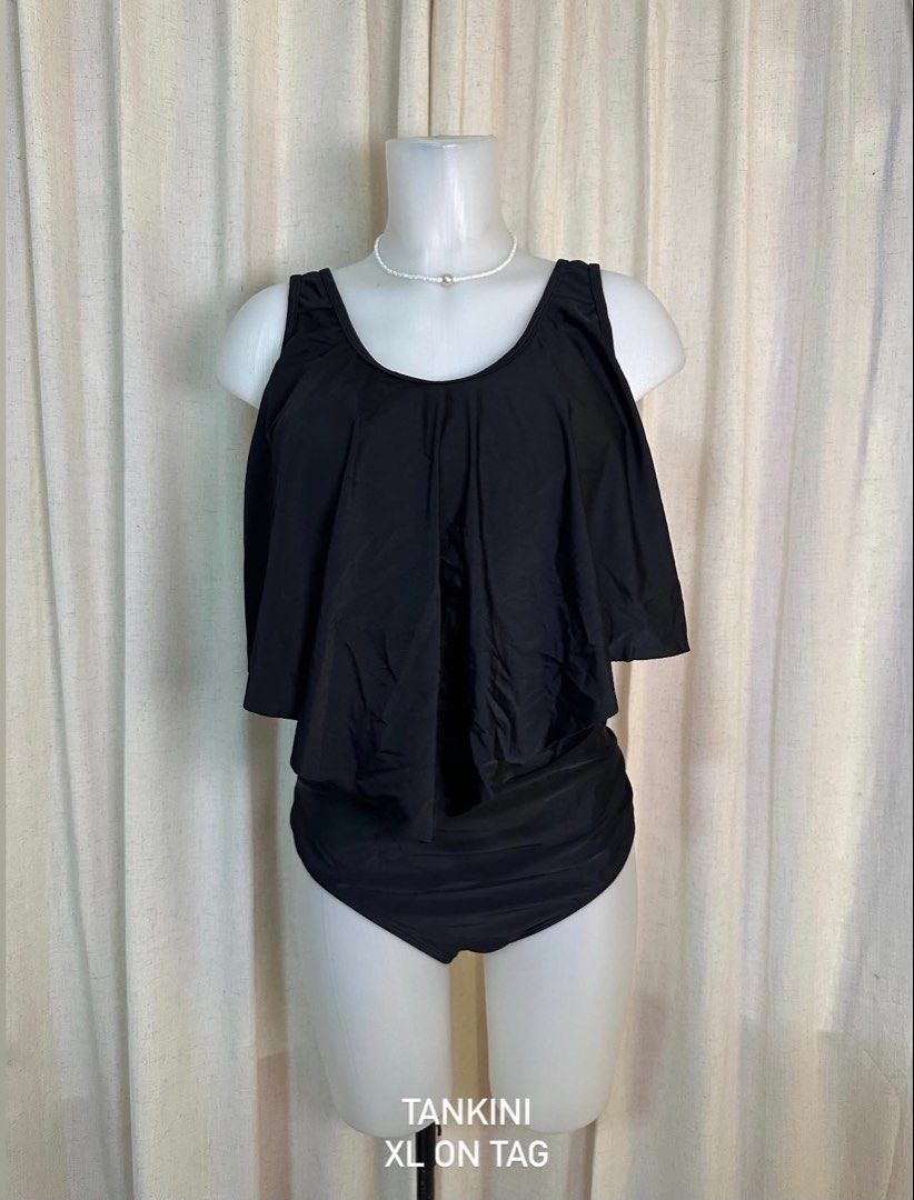Black Tankini Swimsuit XL (Category: Bikinis & Swimsuits) located in Baybay. Submitted by comicowl (Listing ID 1457562763, Image 1). Description: - Black tankini swimsuit - Ruffled overlay detail - High-waisted brief bottoms - Size XL (fits true to size) - Ideal for swimming and beach outings.
