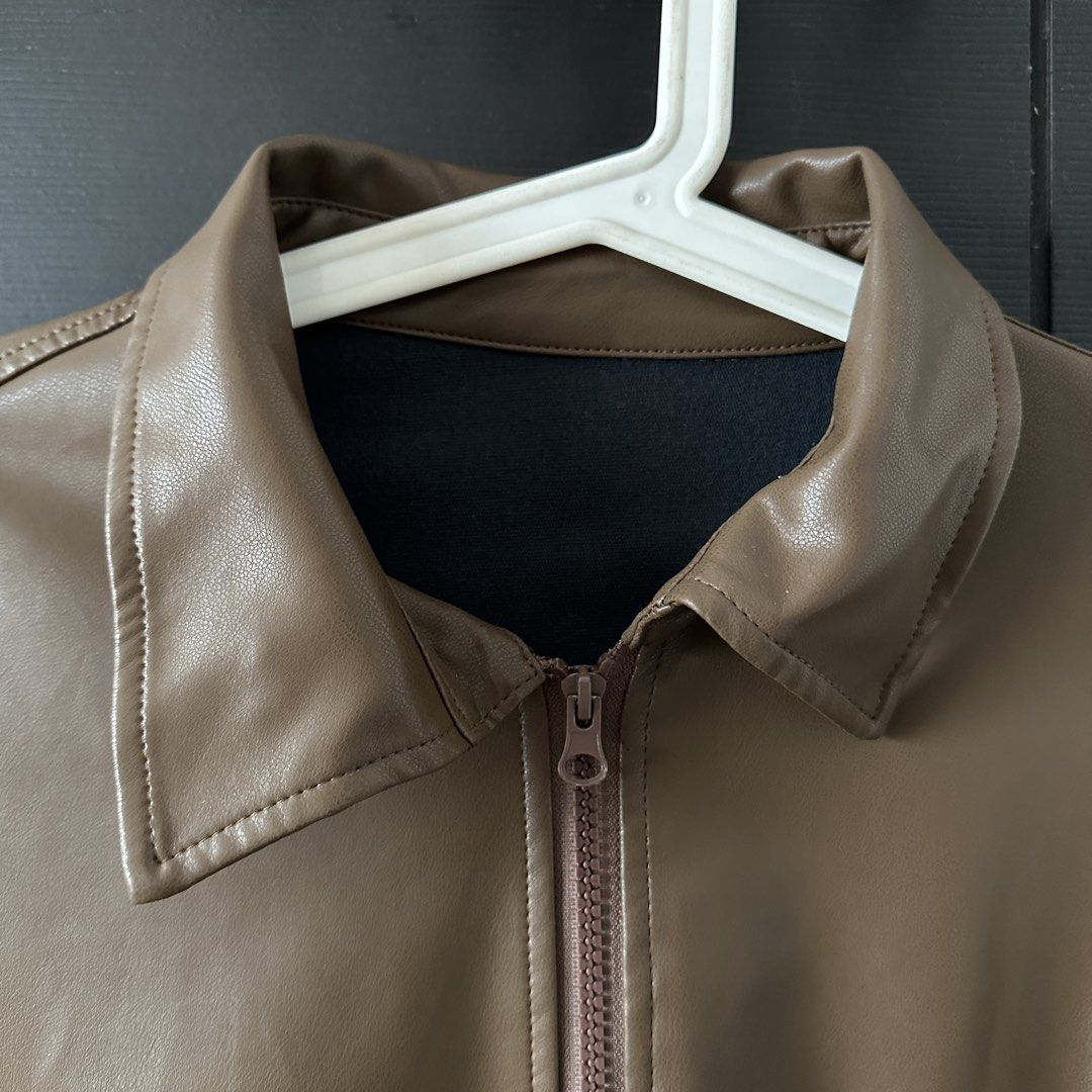 Brown Faux Leather Bomber Jacket (Category: Coats, Jackets and Outerwear) located in Angeles City. Submitted by tamm09 (Listing ID 1457603564, Image 3). Description: - Cool brown faux leather jacket - Zip-up front with a collar - Two side pockets.