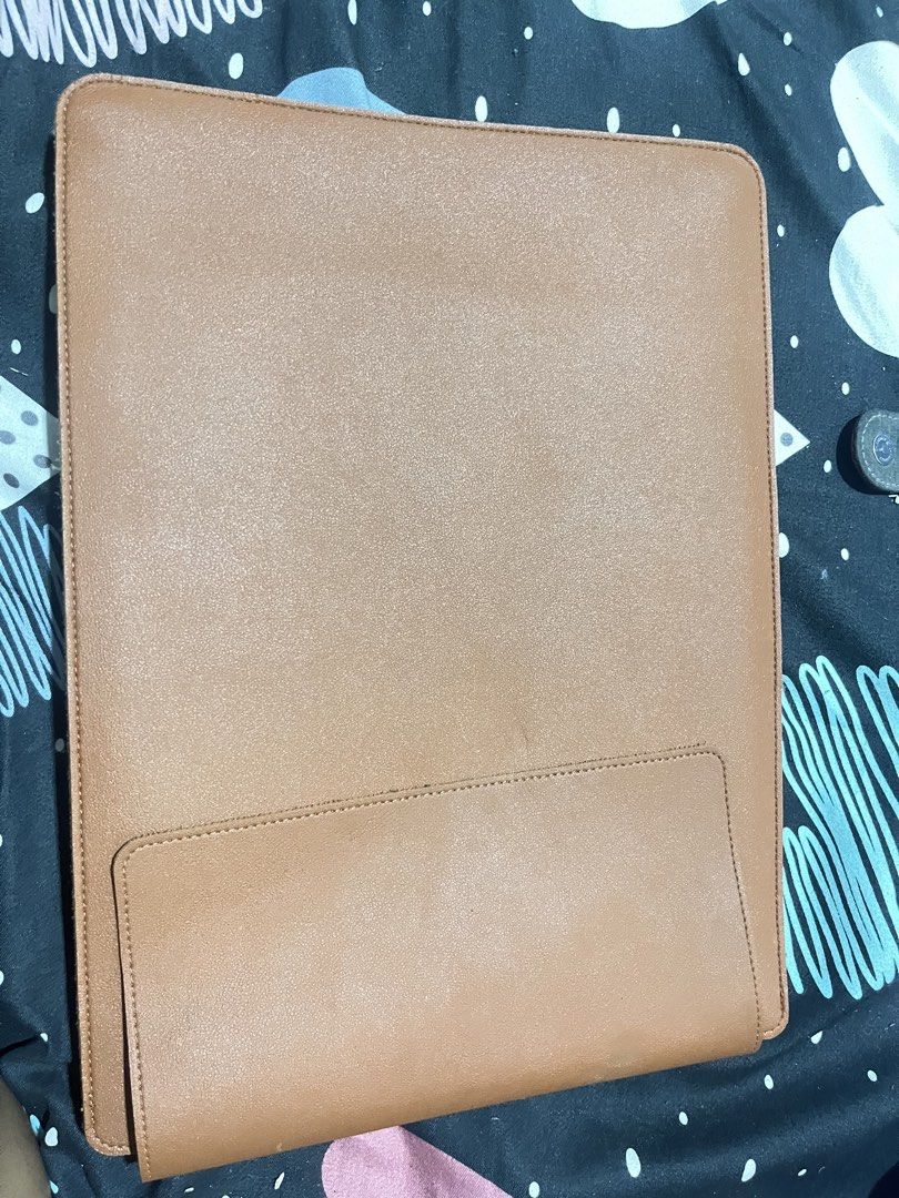 Brown Leather Laptop Sleeve with Stand (Category: Laptop Bags & Sleeves) located in Naga. Submitted by Carmel_C (Listing ID 1457662026, Image 2). Description: - Premium brown leather laptop sleeve - Integrated stand for hands-free viewing - Designed to fit most standard laptops - Convenient exterior pocket for accessories - Offers excellent protection for your device on the go - Sleek and minimalist design.